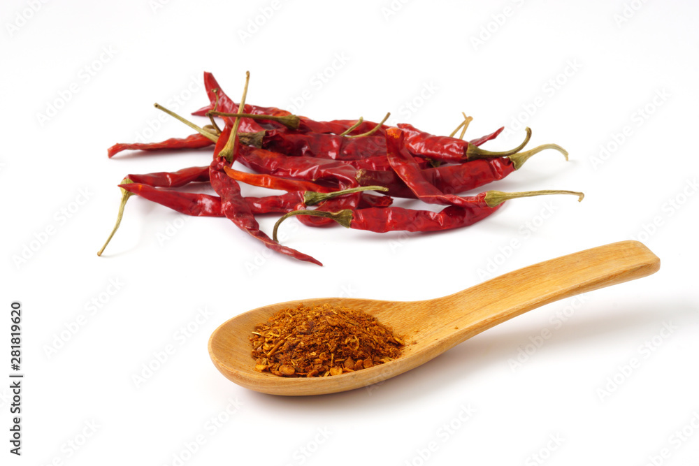 Fototapeta premium Dried chili pepper and Cayenne pepper in wood spoon isolated on white background