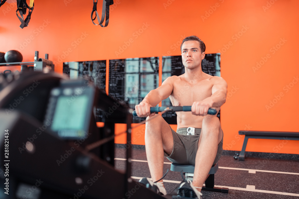 Serious good looking man concentrating on the training Serious good looking man concentrating on the training