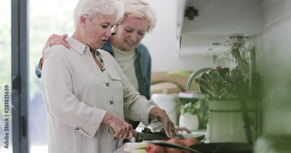 Mature lesbian couple cooking a meal together at home Stock-Video | Adobe Stock