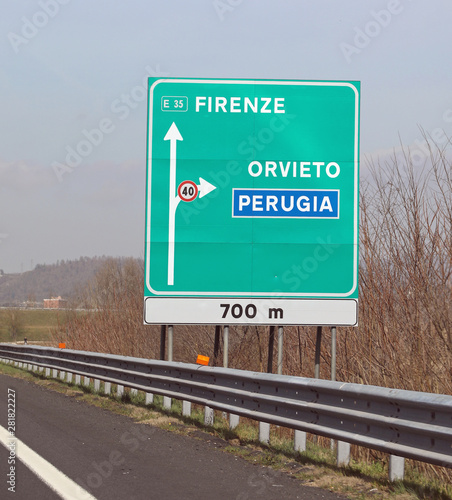 big highway signs with italian text with name of city photo