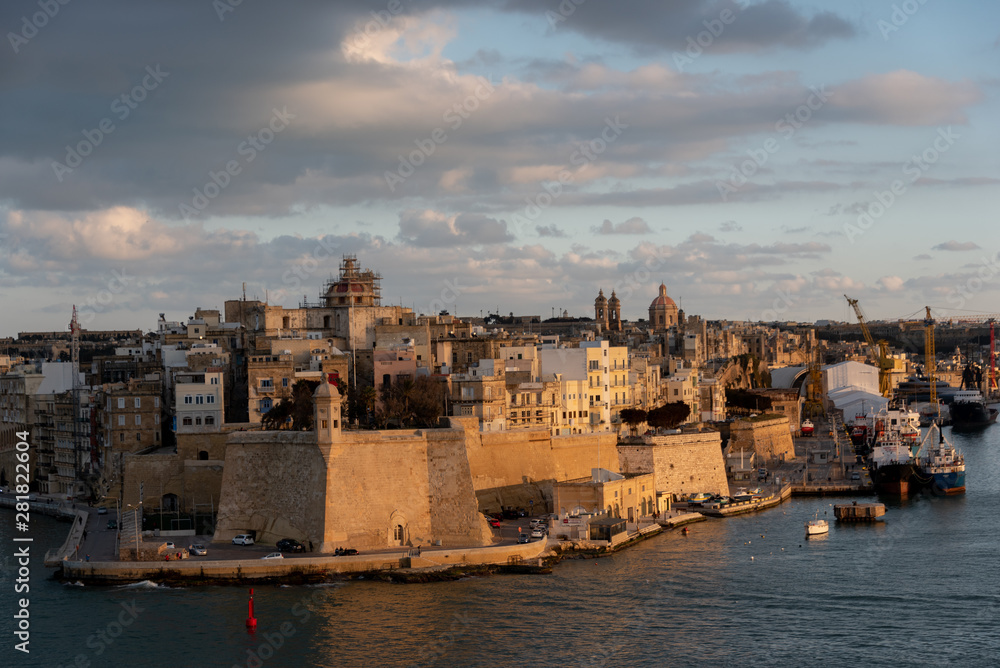 view of the urban landscape and the port of marseille at sunset