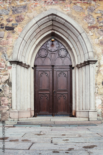 Gothic architecture, wooden, antique door with a pattern © Natalia Timchenko
