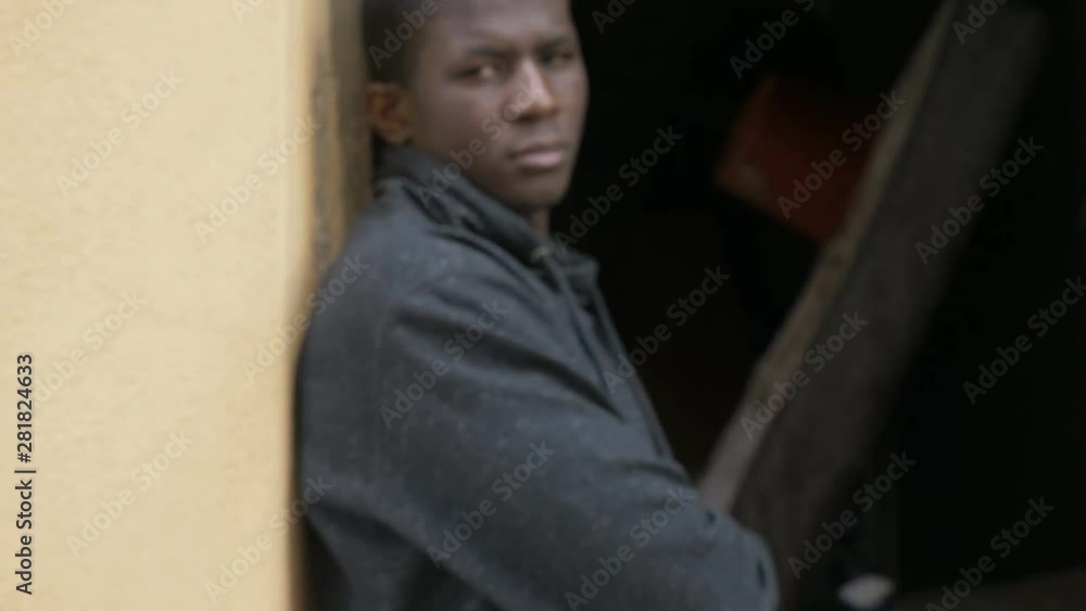 serious angry black african man staring at camera- steady cam