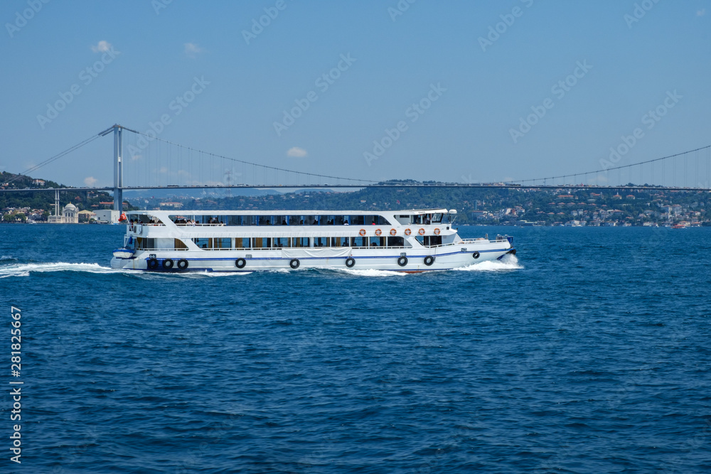 Istanbul, Turkey, Bosphorus Bridge and Uskudar Coast. Pleasure boats sail on the Bosphorus