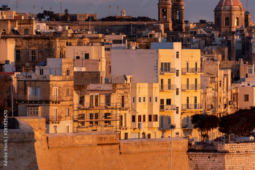 view of the urban landscape and the port of marseille at sunset