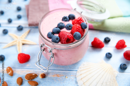 Ice cream with berries, raspberry and blueberry in glass jar