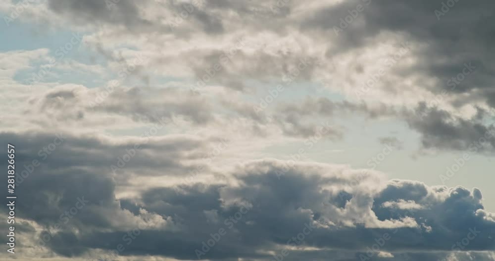 Timelapse of clouds moving fast. Cloudy blue sky Time lapse. Grey clouds motion in horizon. Blue cloudscape with fluffy, puffy cloud. Timelapse of clouds moving fast. Cloudy blue sky Time lapse. Grey clouds motion in horizon. Blue cloudscape with fluffy, puffy cloud.