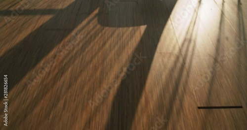 Timelapse, Shadow and light on the parquet flooring. Floorlamp, curtains  shadowing  Wooden floor. photo