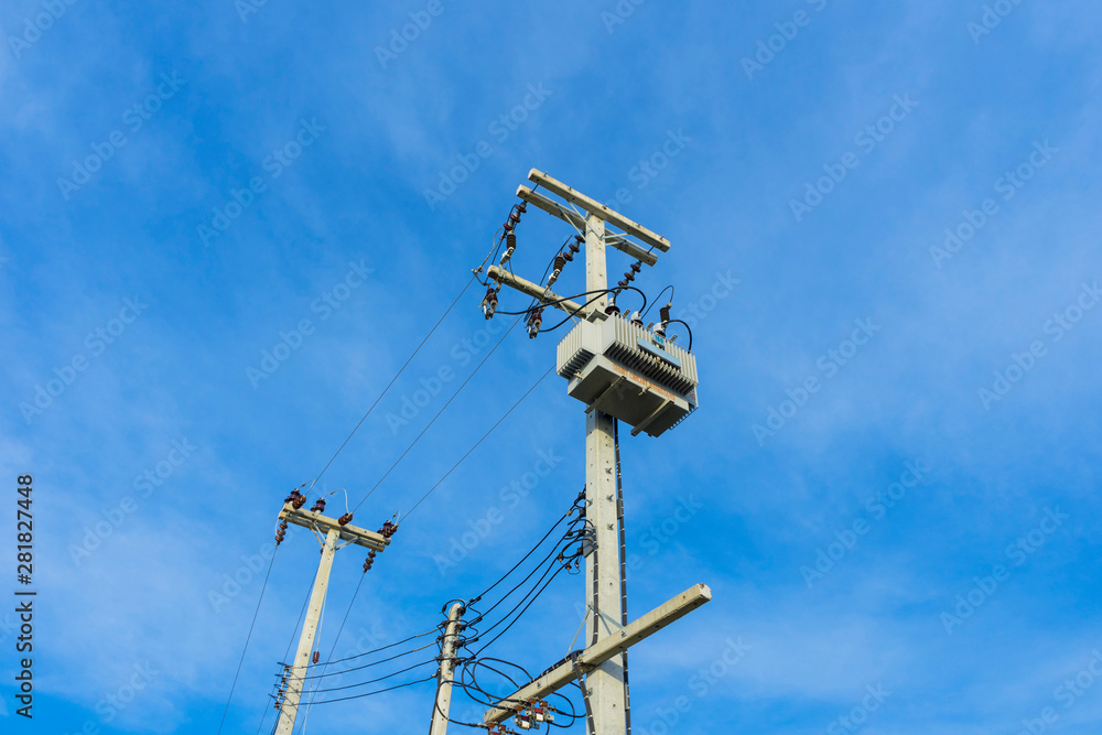Electric distribution transformer pole and blue sky. Electric distribution transformer pole and blue sky.