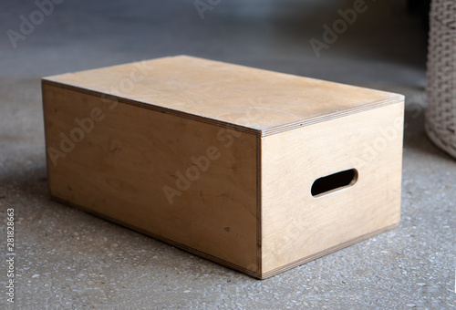 Apple boxes are wooden boxes with holes on each  in film production.