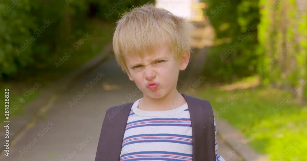 Portrait of a cute little boy scrunching his nose and acting grumpy Portrait of a cute little boy scrunching his nose and acting grumpy