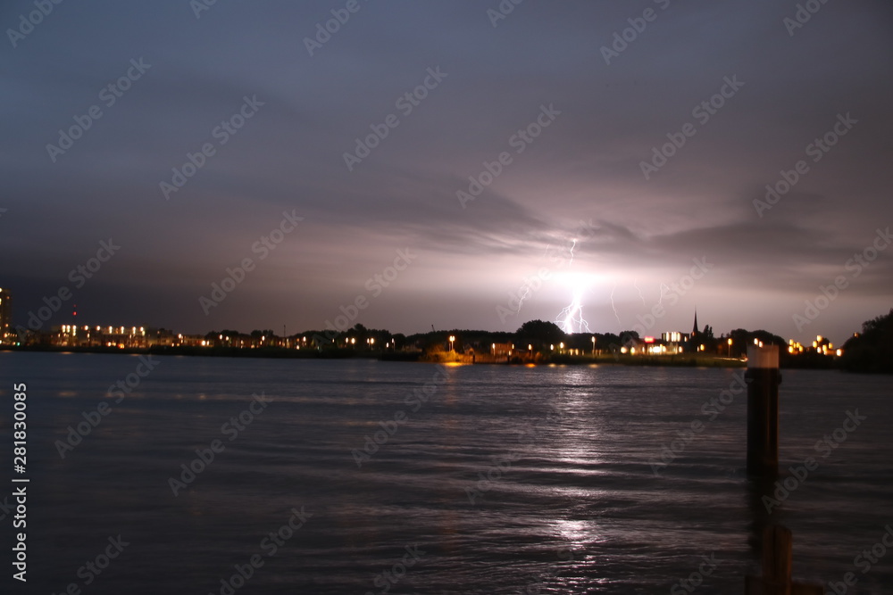 Thunderstrikes over the Rotterdam Skyline at river Nieuwe Maas in the Netherlands