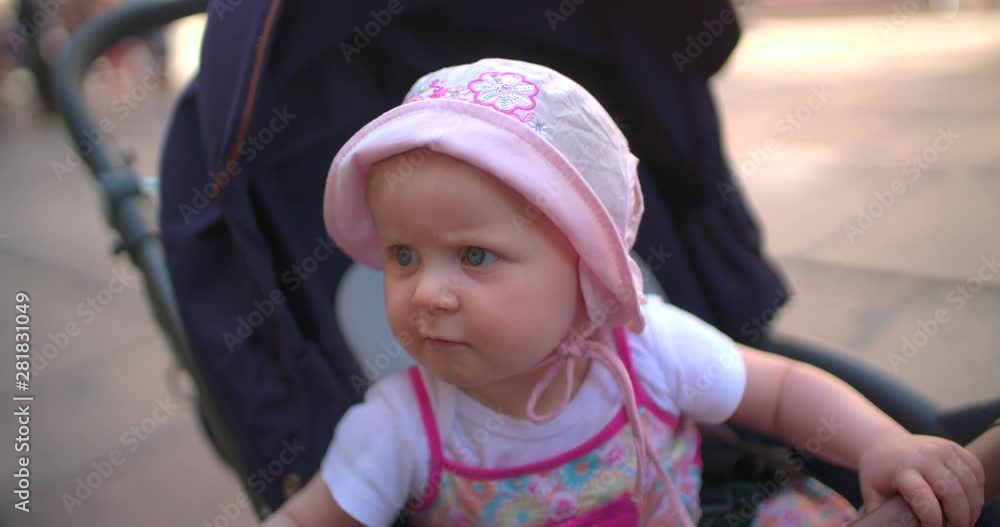 Babygirl in stroller slow motion Babygirl in stroller slow motion