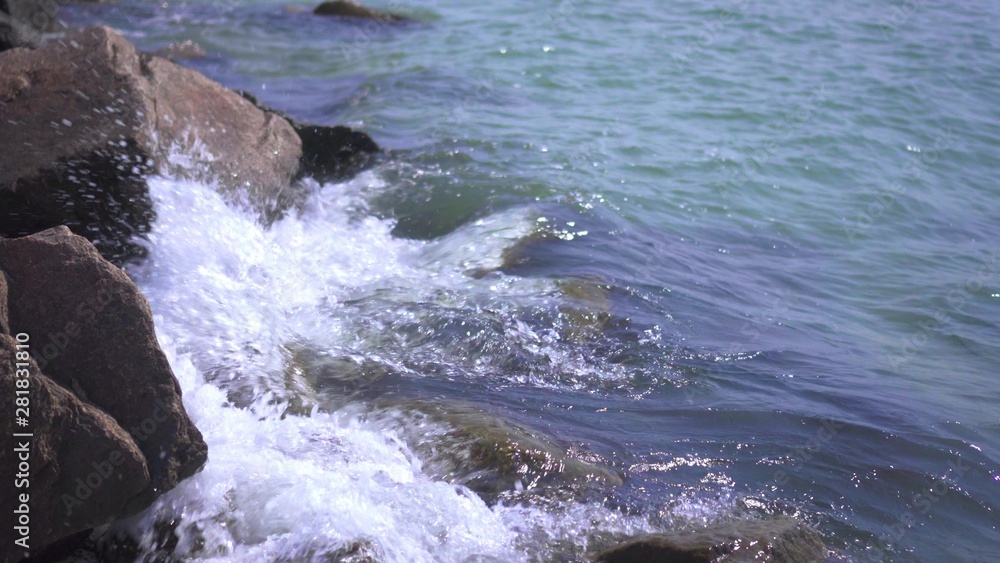 Sea surf. The waves hit the rocks. Sea coast. Splashing water.