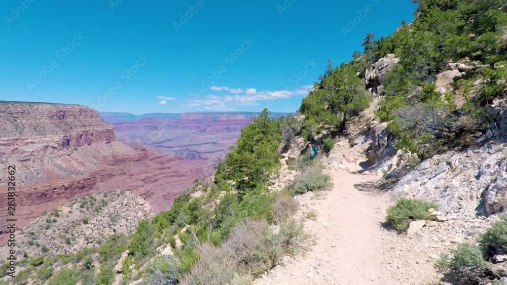 Walking down the path into Grand Canyon in Grand Canyon national park Walking down the path into Grand Canyon in Grand Canyon national park