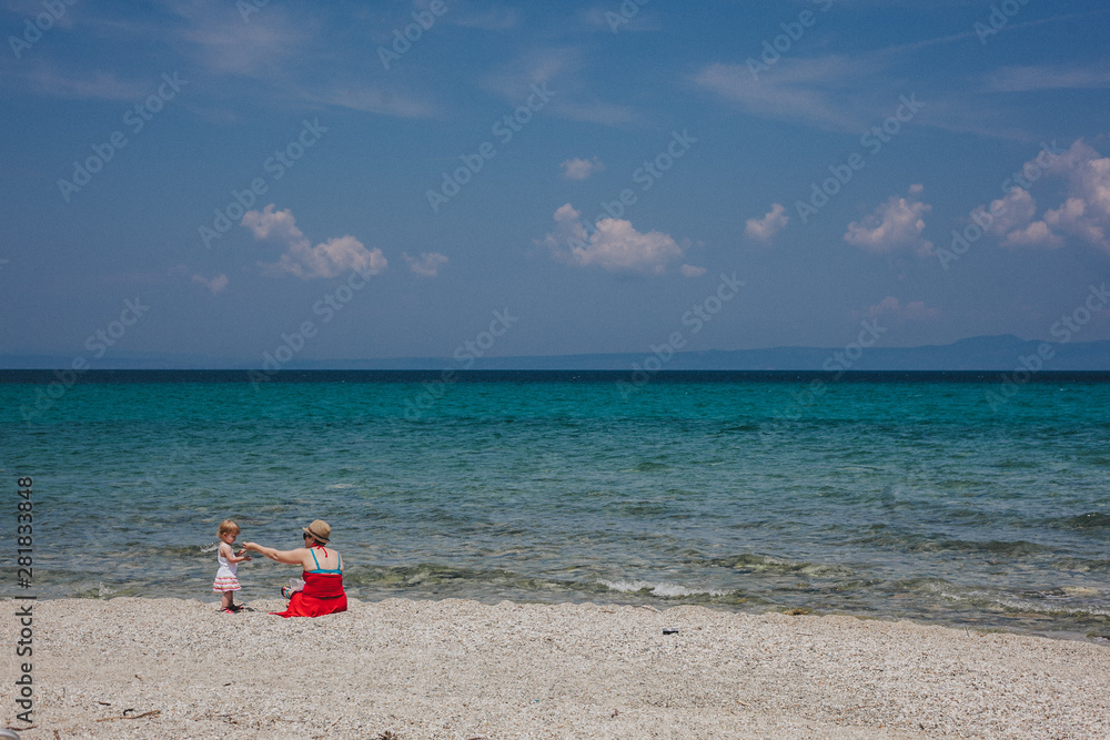 Mother and Daughter Playing at a Beach
