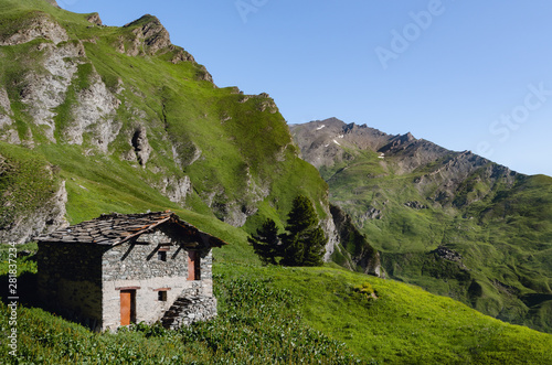 Very old abandoned traditional alpine house, used in the past by shepherd of the italian alps of piedmont, near cuneo, Italy