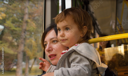 Mother and small daughter in a bus