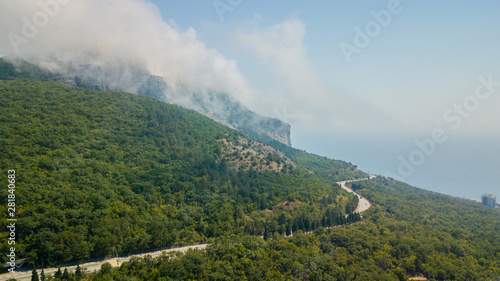 Crimean roads  aerial view of curvy mountain road in summer day