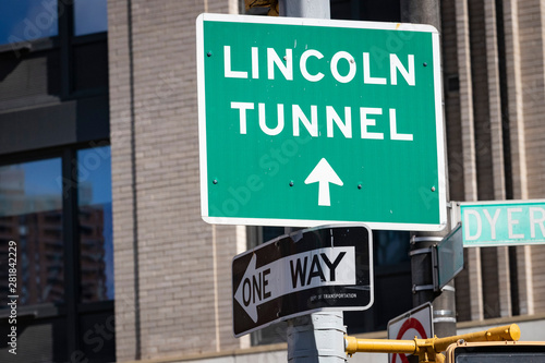 Directional street sign: "LINCOLN TUNNEL" directing traffic to exit Manhattan