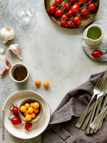 Ingredinets for baked feta cheese with cherry tomatoes and herbs. Background photo