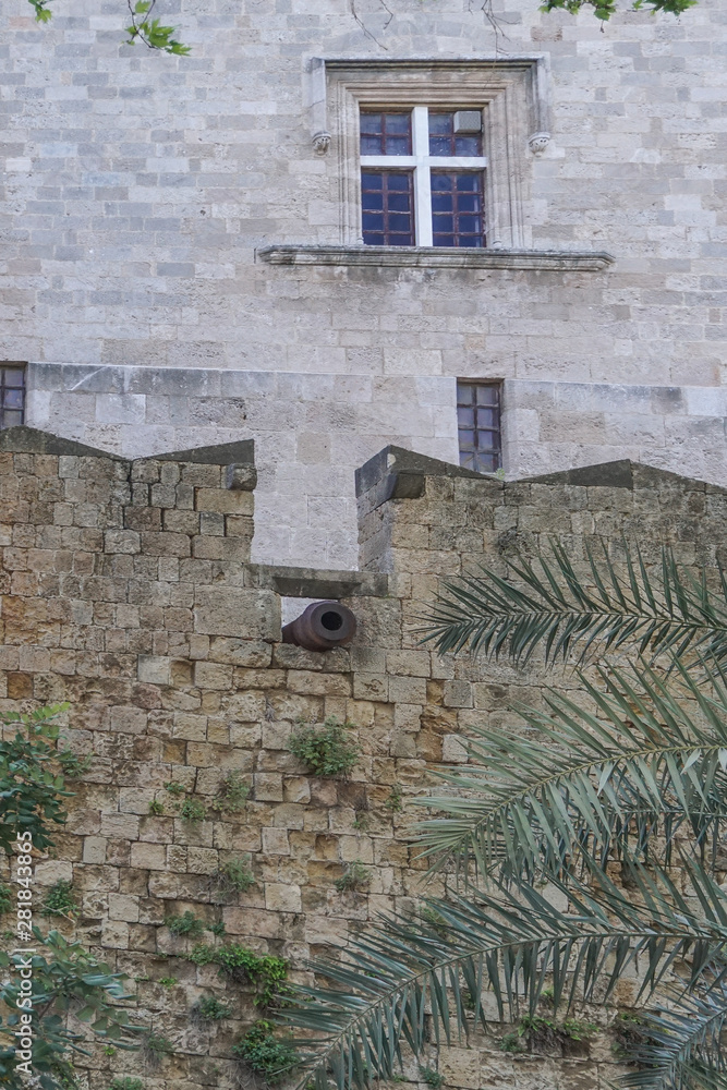 Rhodes, Greece: A cannon protrudes from a wall in the 14th-century Palace of the Grand Master of the Knights of Rhodes.