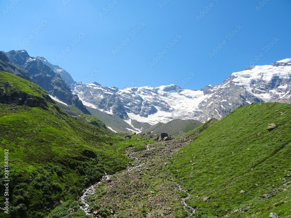 The Alps with its woods and glaciers near Monte Rosa and the town of Macugnaga, Italy - July 2019.