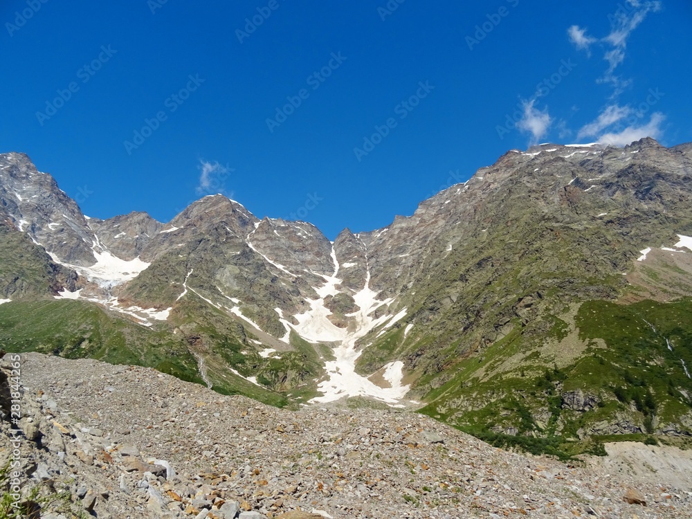 The Alps with its woods and glaciers near Monte Rosa and the town of Macugnaga, Italy - July 2019. The Alps with its woods and glaciers near Monte Rosa and the town of Macugnaga, Italy - July 2019.