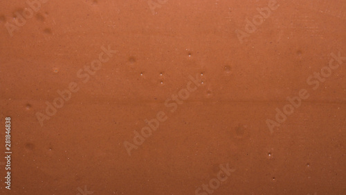 Smooth texture of milk chocolate.Chocolate background. photo