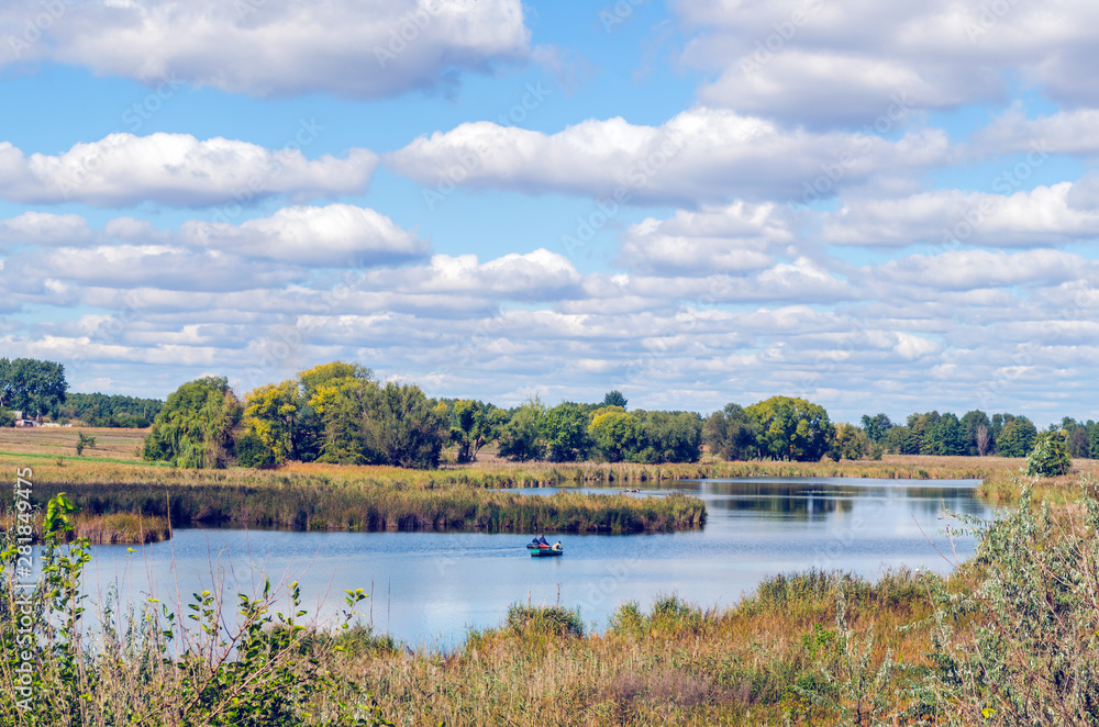 Beautiful summer landscape with a river and blue sky. Beautiful summer landscape with a river and blue sky.