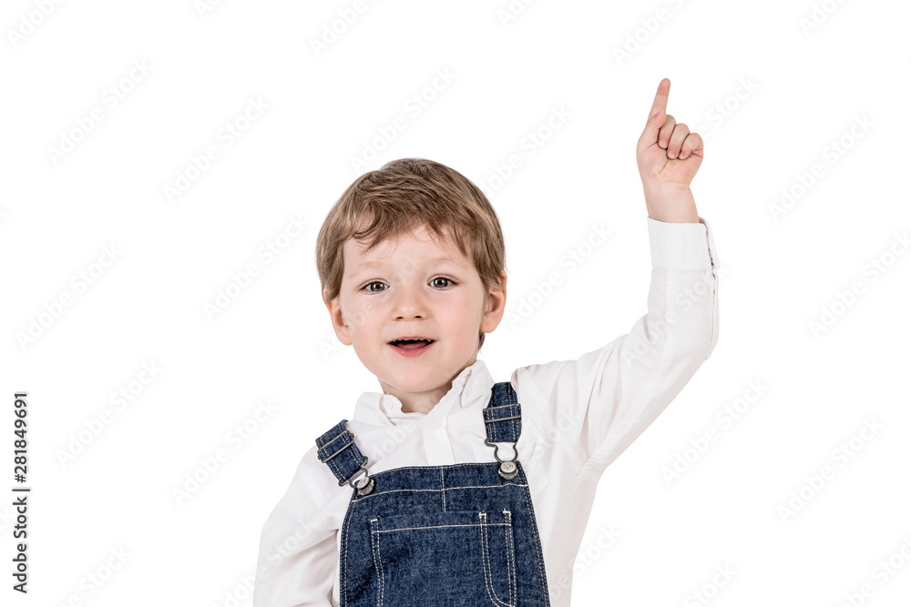 Happy adorable little boy pointing upwards Happy adorable little boy pointing upwards