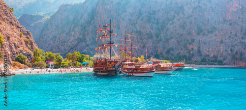 Fototapeta Naklejka Na Ścianę i Meble -  Tourists visit famous Butterfly Valley beach near Oludeniz