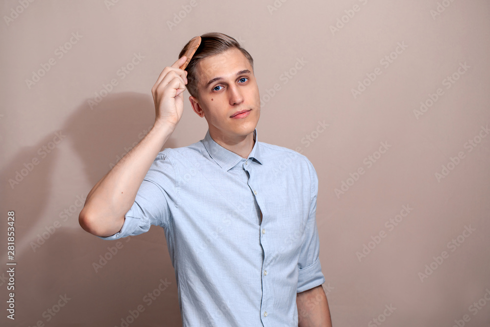 European guy combing his hair European guy combing his hair