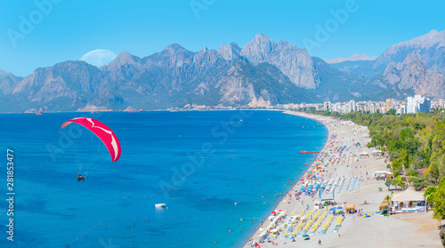 Fototapeta Naklejka Na Ścianę i Meble -  Paraglider flies in the sky - Konyaalti Beach, Antalya Turkey