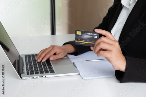 Business woman consumer holding credit card for online shopping and payment make a purchase on the Internet