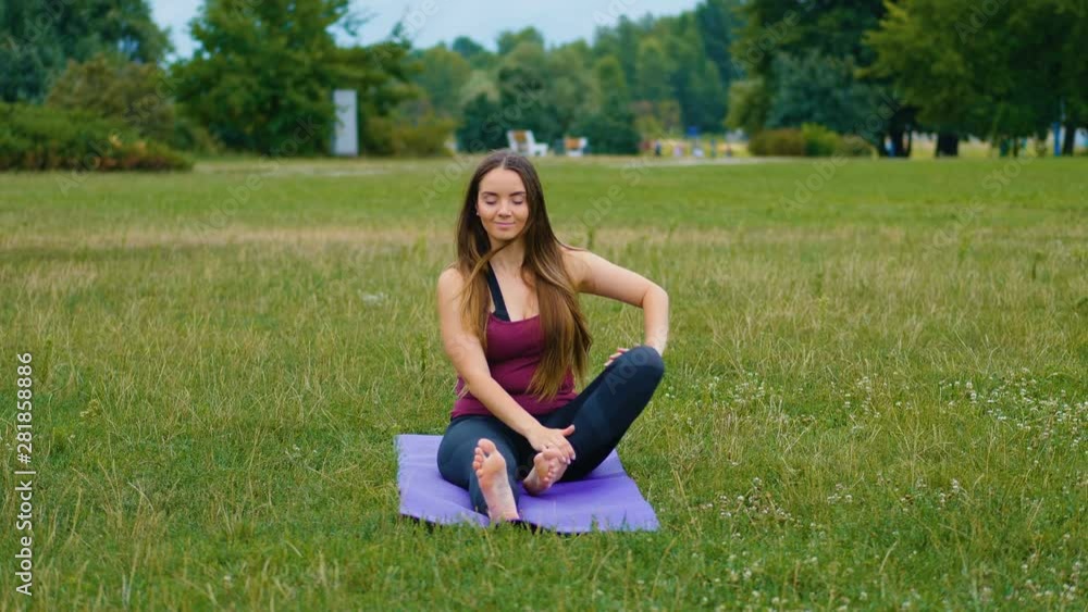 Young beautiful woman practicing yoga outdoor. Wellness concept. Calmness and relax, woman happiness. Young beautiful woman practicing yoga outdoor. Wellness concept. Calmness and relax, woman happiness.