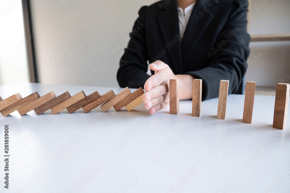 hand stop blocks wood game, gambling placing wooden block. Concept Risk of management and strategy plan, protect business to success hand stop blocks wood game, gambling placing wooden block. Concept Risk of management and strategy plan, protect business to success