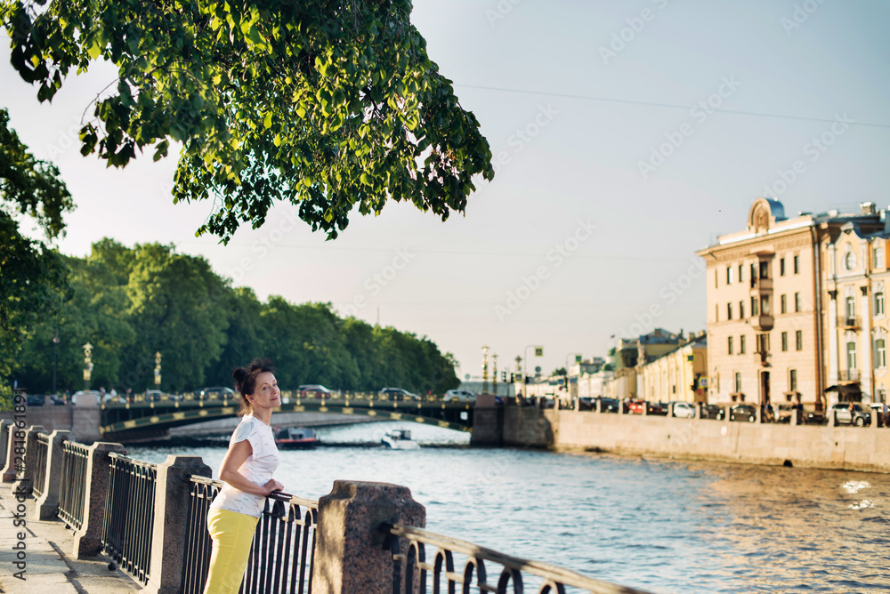 custom made wallpaper toronto digitalA beautiful tourist of Mature age admires the views of the city of St. Petersburg
