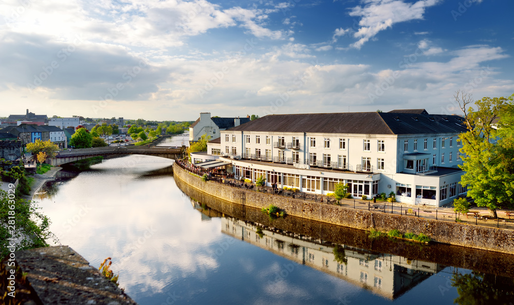 Bank of the River Nore in Kilkenny, one of the most beautiful town in Ireland. Warm summer evening.