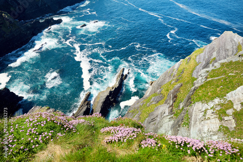 Amazing wave lashed Kerry Cliffs, the most spectacular cliffs in County Kerry, Ireland. Tourist attractions on famous Ring of Kerry route. photo