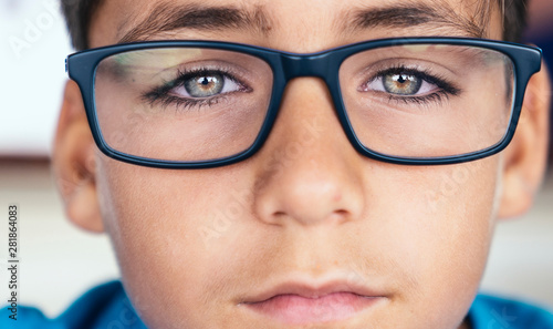 Green eyes boy with glasses