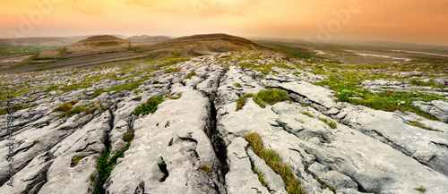 Spectacular landscape of the Burren region of County Clare, Ireland. Exposed karst limestone bedrock at the Burren National Park. photo