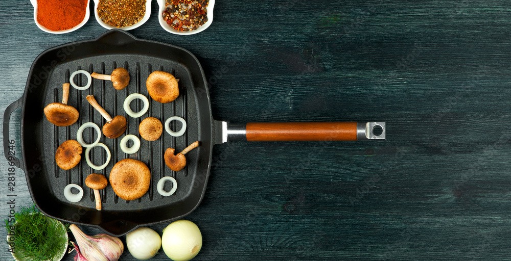Fresh mushrooms with spices and herbs on black board. View from above. Copy space. Fresh mushrooms with spices and herbs on black board. View from above. Copy space.