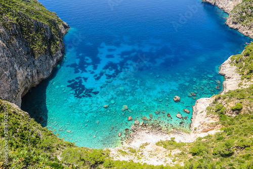 Photos Above view of clear blue sea bay with rocky beach