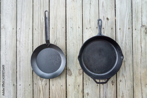 Traditional cast iron vs carbon steel versus teflon cooking options - copy space