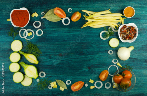 VEGETABLES ON BACKGROUND. FRESH VEGETABLES AND SPICES ON A WOODEN SURFACE. COPY SPACE