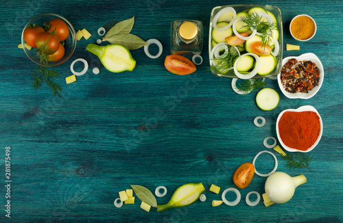 VEGETABLES ON BACKGROUND. FRESH VEGETABLES AND SPICES ON A WOODEN SURFACE. COPY SPACE