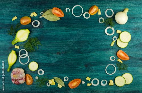 VEGETABLES ON BACKGROUND. FRESH VEGETABLES AND SPICES ON A WOODEN SURFACE. COPY SPACE