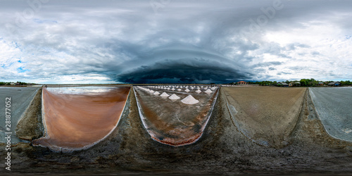 VR360 saline in the afternoon, the sky covered with rain clouds. See the clouds of Arcas far away. On the left is the saline, there are crystals mixed in water. In the middle is the pile to gather.