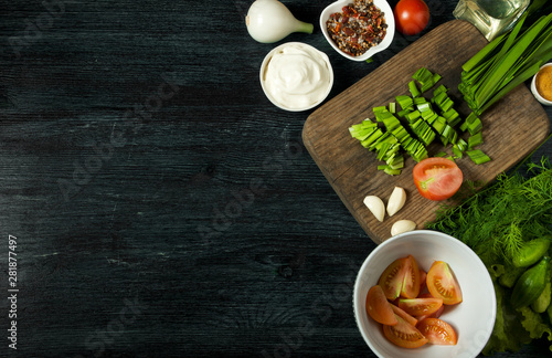 Vegetables on the background. Fresh vegetables on a dark board on a textured background. View from above. Copy space.